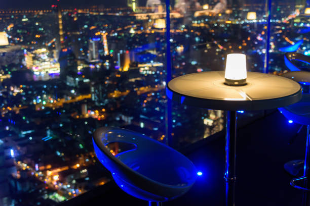 istock empty chair with lighting at rooftop bar on high building 1149370145