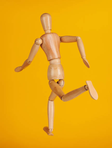 istock Wooden man toy running 1149375895