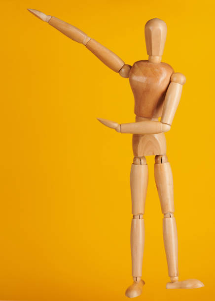 istock Toy man in showing pose 1149375905