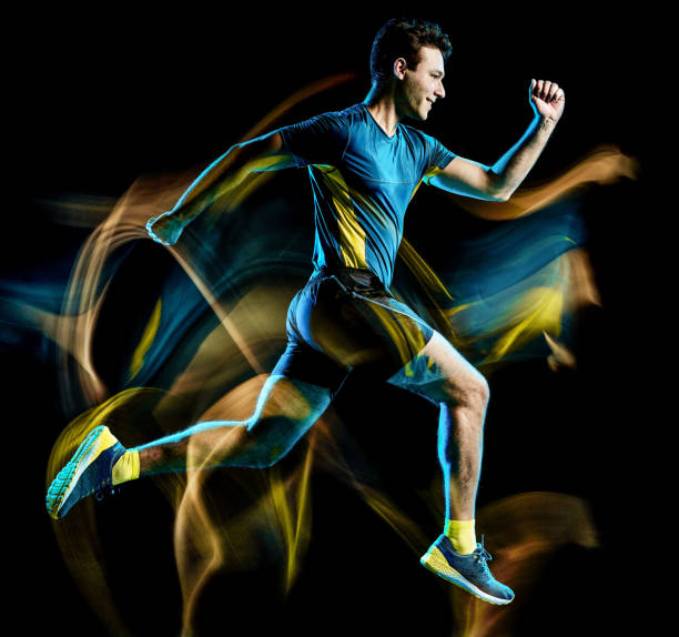 istock runner running jogger jogging man isolated light painting black background 1149377501