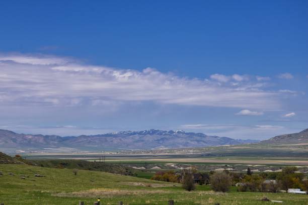 Tremonton and Logan Valley landscape views from Highway 30 pass, including Fielding, Beaverdam, Riverside and Collinston towns, by Utah State University, in Cache County along the Wasatch Front Range of the Rocky Mountains in Utah, USA.