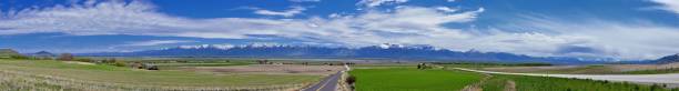 Tremonton and Logan Valley landscape views from Highway 30 pass, including Fielding, Beaverdam, Riverside and Collinston towns, by Utah State University, in Cache County along the Wasatch Front Range of the Rocky Mountains in Utah, USA.