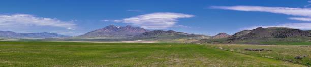 Tremonton and Logan Valley landscape views from Highway 30 pass, including Fielding, Beaverdam, Riverside and Collinston towns, by Utah State University, in Cache County along the Wasatch Front Range of the Rocky Mountains in Utah, USA.