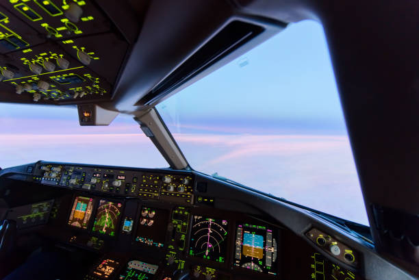 istock Beautiful twilight sunset sky at high altitude from airplane cockpit view. Inside cockpit can see flight instruments of airplane. 1149384903