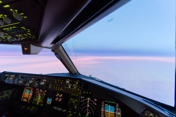 istock Beautiful twilight sunset sky at high altitude from airplane cockpit view. Inside cockpit can see flight instruments of airplane. 1149384906