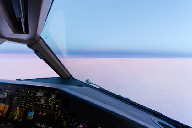 istock Beautiful twilight sunset sky at high altitude from airplane cockpit view. Inside cockpit can see flight instruments of airplane. 1149384954