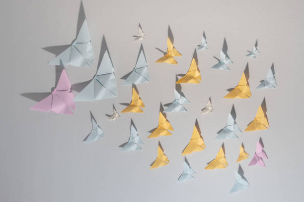 istock Butterfly paper on the white room wall. 1149392526