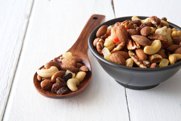 istock Mix nuts and dried fruits background and wallpaper. 1149393582