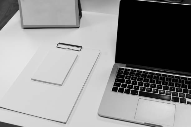 istock Office desk table with computer and supplies. Top black and white view. Copy space for text 1149398791