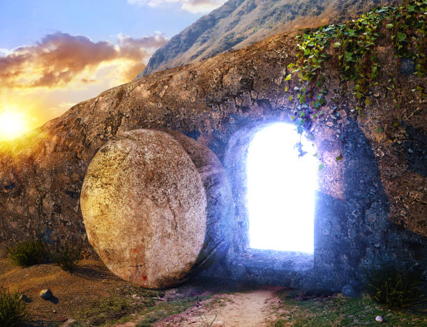 He is Risen. Crucifixion at Sunrise. Light From Within The Tomb Of Jesus. Outside view on Tomb. 3D illustration stock photo