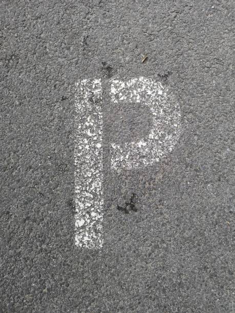 istock Letter P stenciled in white on asphalt 1149400634