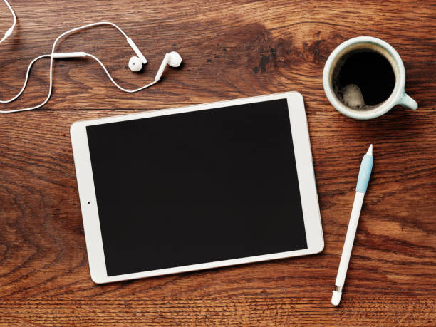 istock Digital tablet and pencil on a wooden table. Calligraphy and lettering mockup. Flat lay. 1149400978