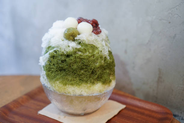 Test matcha kakigori. Shaved ice in japanese style. Green tea shaved ice topped with dango and red beans. adzuki bean photos stock pictures, royalty-free photos & images