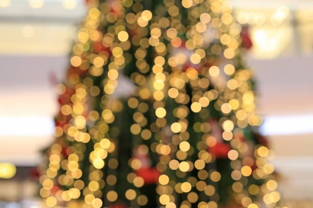 istock Blurred colorful bokeh lights on Christmas tree background. 1149406170