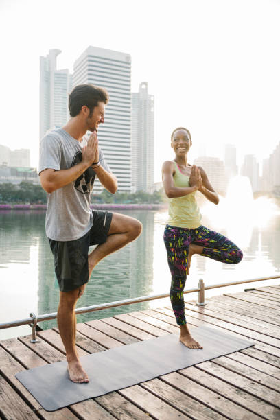 istock Yoga couple in the park 1149409729