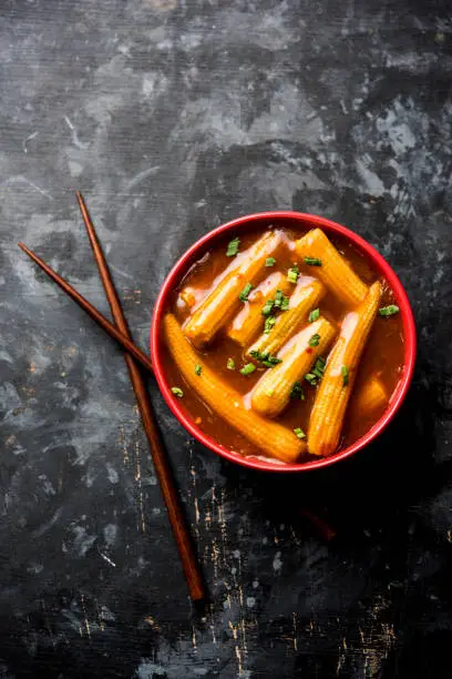 Photo of Baby Corn Manchurian with gravy - popular Indo-chinese recipe. selective focus