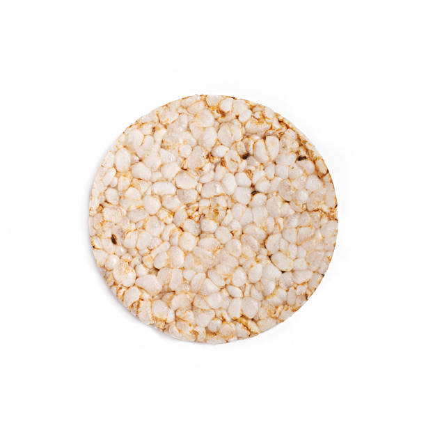 istock Puffed rice bread isolated on white background. Diet rice bread. Top view. 1149411544