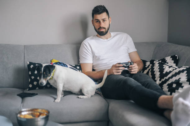 istock Young men at home with his dog 1149413002