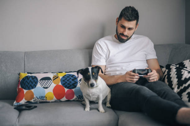 istock Young men at home with his dog 1149415313