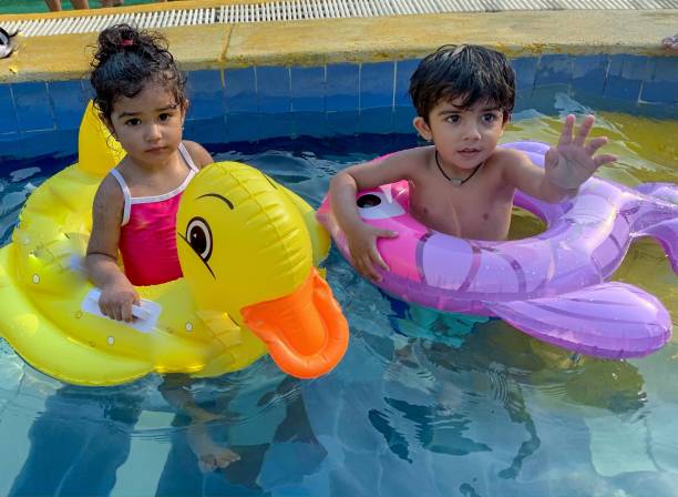 istock Indian kids enjoying in swimming pool 1149415384