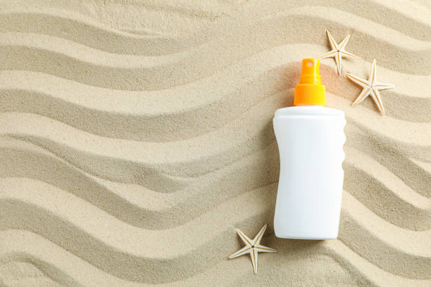 istock Clear sea sand with sunscreen and starfishes, space for text. Summer vacation background 1149416206