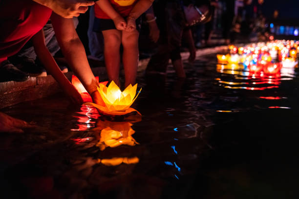 istock Floating colored lanterns and garlands on river at night on Vesak day for celebrating Buddha's birthday in Eastern culture, that made from paper and candle 1149422110