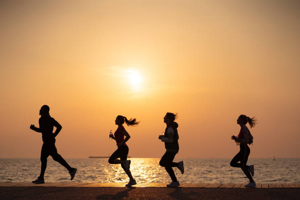 istock Friends jogging by the sea 1149425321