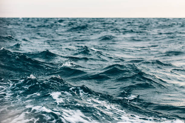istock ripples on blue sea water with white foam , natural sea background 1149425407