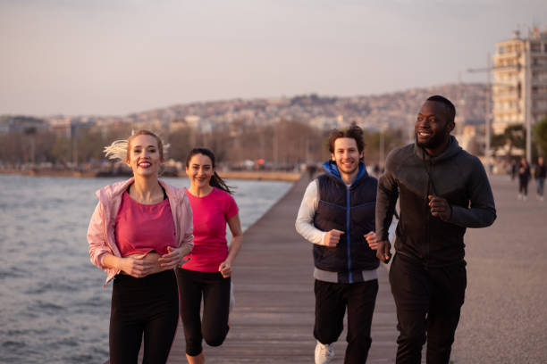 istock Friends jogging by the sea 1149425488