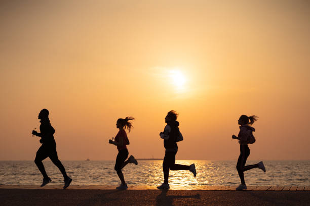 istock Friends jogging by the sea 1149425566