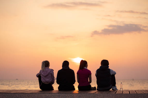 istock Friends enjoying sunset 1149425567