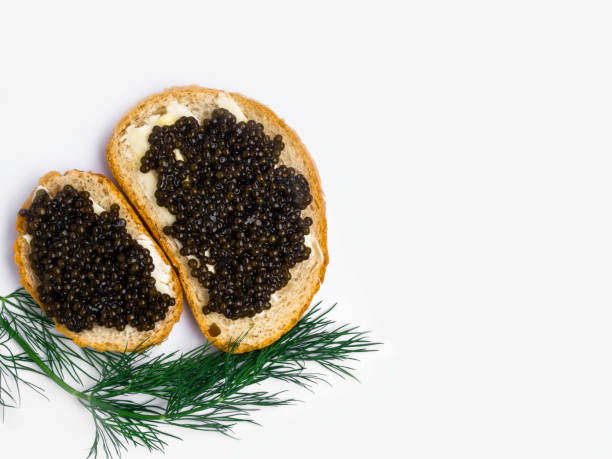 istock Sandwich with black caviar on white background 1149426946