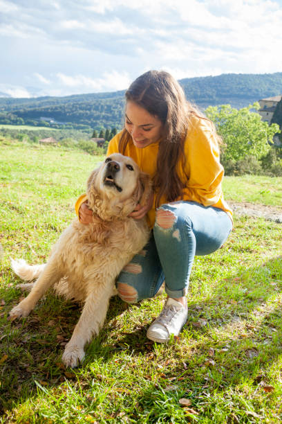 istock Playing with my dog in the meadow 1149428644