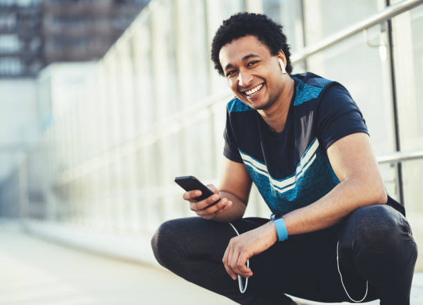 istock Male athlete with smart phone 1149428805