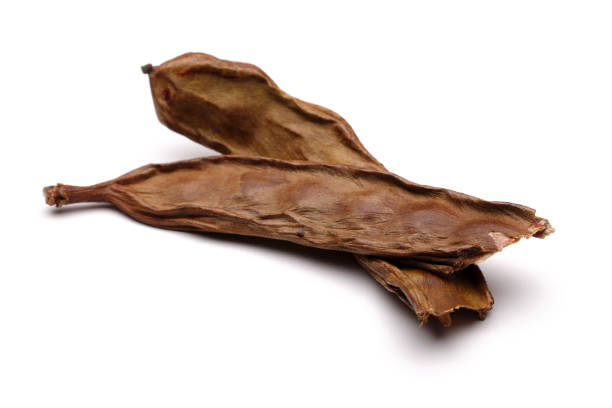 istock Ripe carob bean isolated on white 1149432563