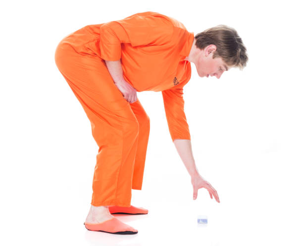 istock Male prisoner picking up dropped soap 1149435513