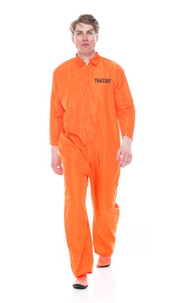 istock Male prisoner wearing orange jumpsuit 1149438723