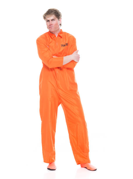 istock Male prisoner wearing orange jumpsuit 1149439416