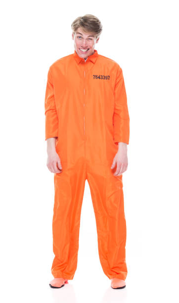 istock Male prisoner wearing orange jumpsuit 1149439667