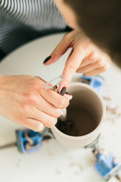 istock Women working on the potter's wheel in the studio 1149439713