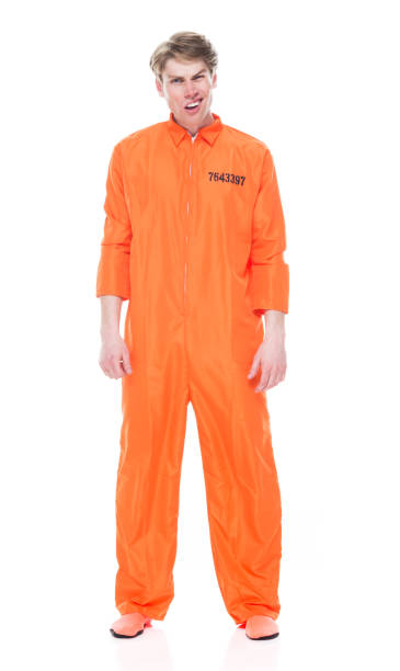 istock Male prisoner wearing orange jumpsuit 1149440438