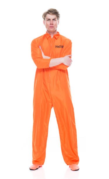 istock Male prisoner wearing orange jumpsuit 1149440465