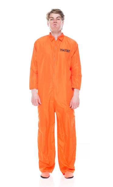 istock Male prisoner wearing orange jumpsuit 1149441239