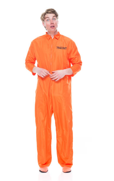istock Male prisoner wearing orange jumpsuit 1149441385