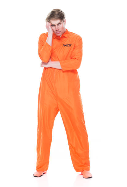 istock Male prisoner wearing orange jumpsuit 1149441695