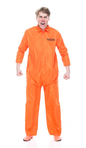 istock Male prisoner wearing orange jumpsuit 1149442291