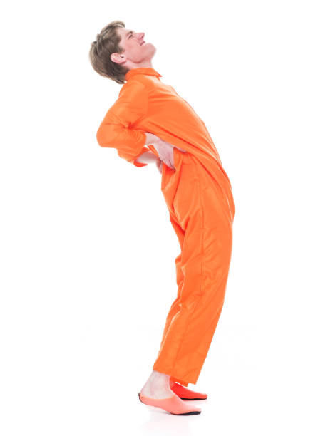 istock Male prisoner wearing orange jumpsuit 1149442620