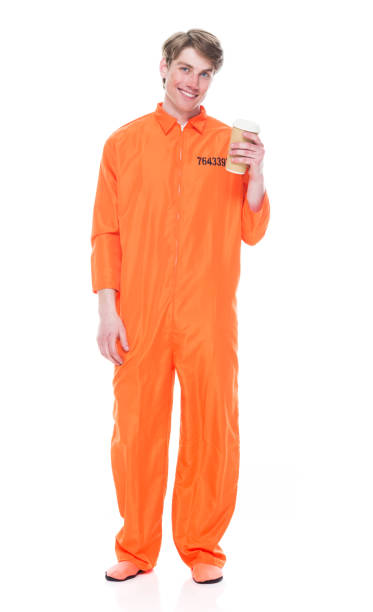 istock Male prisoner wearing orange jumpsuit 1149442992