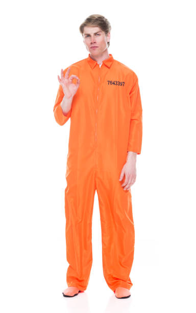 istock Male prisoner wearing orange jumpsuit 1149443099