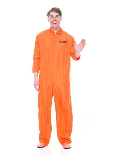 istock Male prisoner wearing orange jumpsuit 1149443127